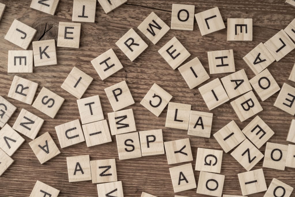 cube letters on a wooden table as a background